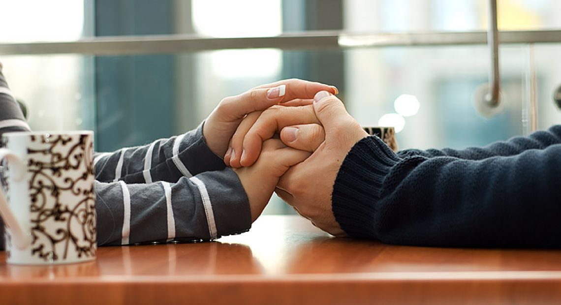couple-holding-hands-table-900px__42290_zoom.jpg